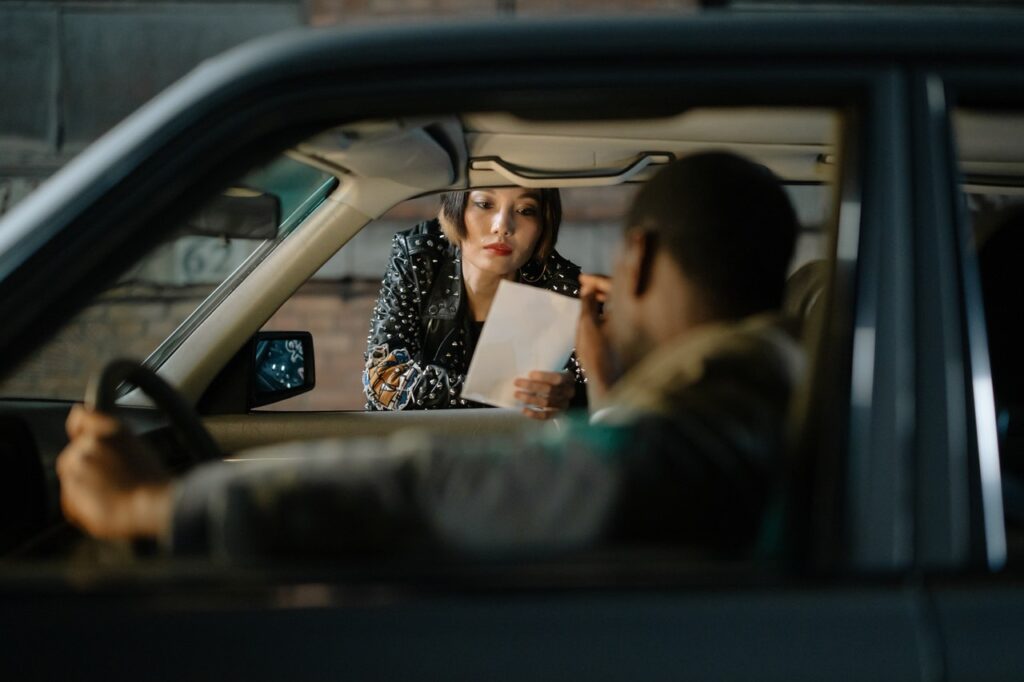 man shows woman a photo